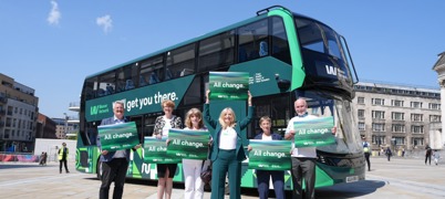 West Yorkshire leaders standing in front of a bus with the new, green Weaver design