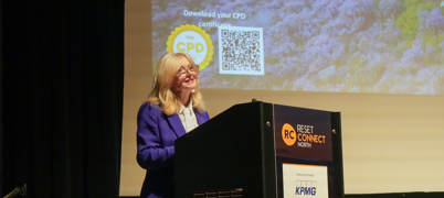 Tracy Brabin standing at a podium speaking into a microphone at Reset Connect North