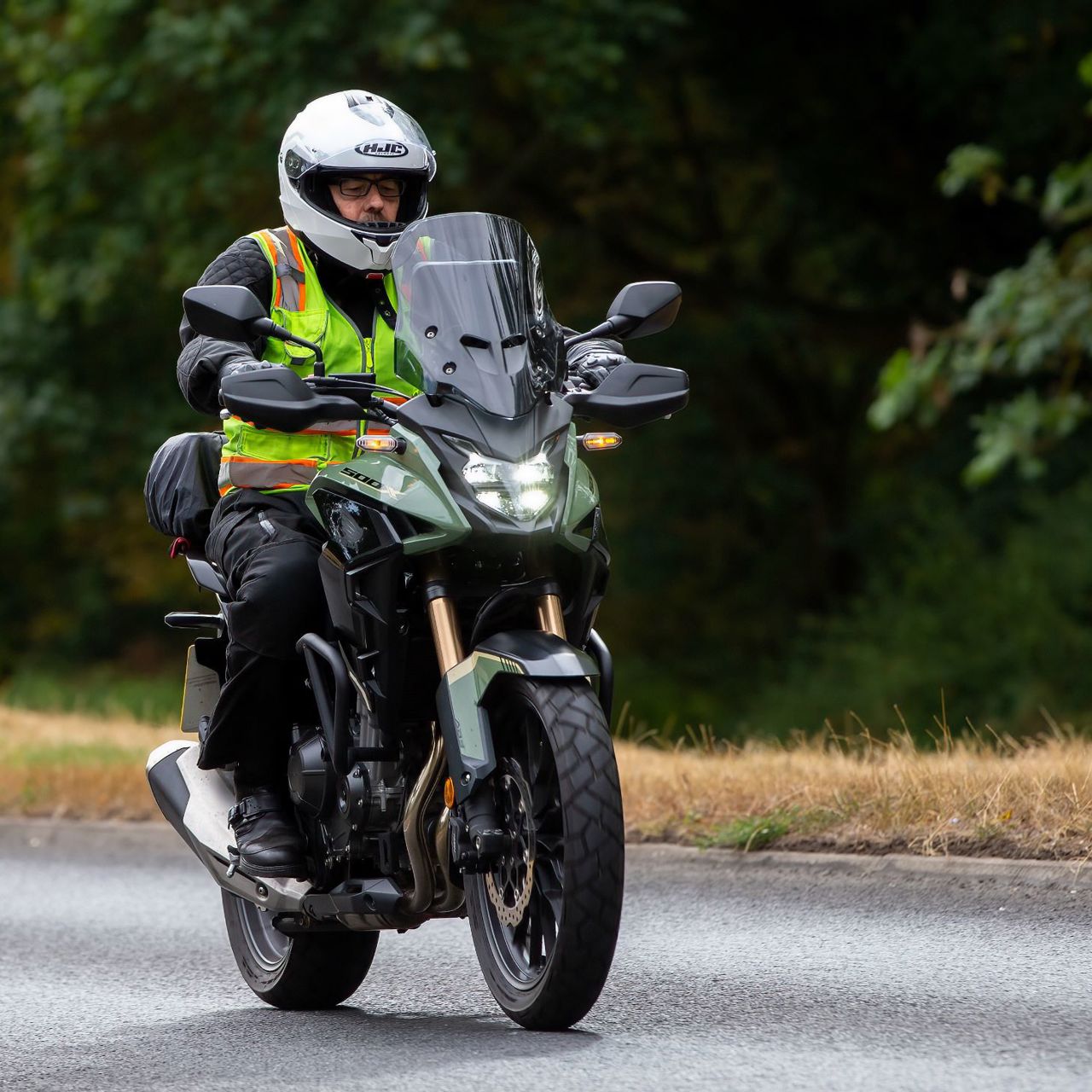 Motorcyclist wearing a hi-viz vest