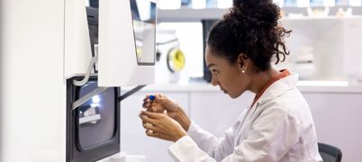 Scientist looks into equipment