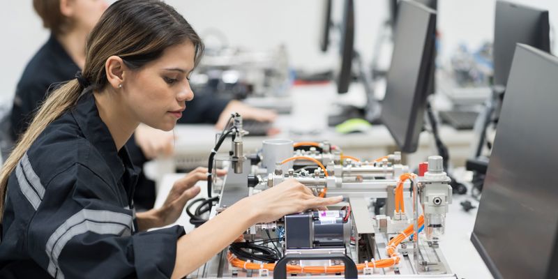 Female Engineer Training Programmable Logic Controller In The Laboratory Room Stock